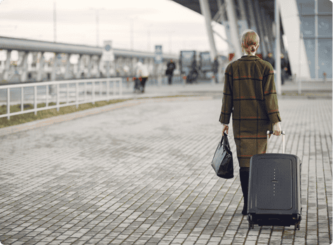 Woman waiting outside an airport